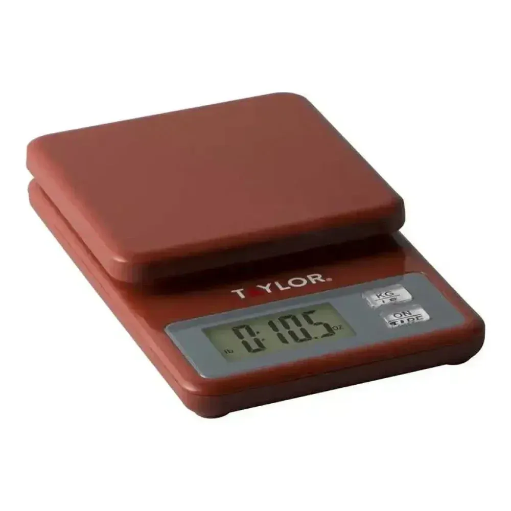 Taylor compact red digital scale with easy-to-read display, provides fast and accurate measurements for food prep in vibrant or modern kitchen settings.