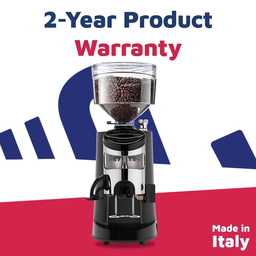 Nuova Simonelli automatic espresso grinder in brushed finish with side display and large hopper placed on a wood counter with soft café lighting.