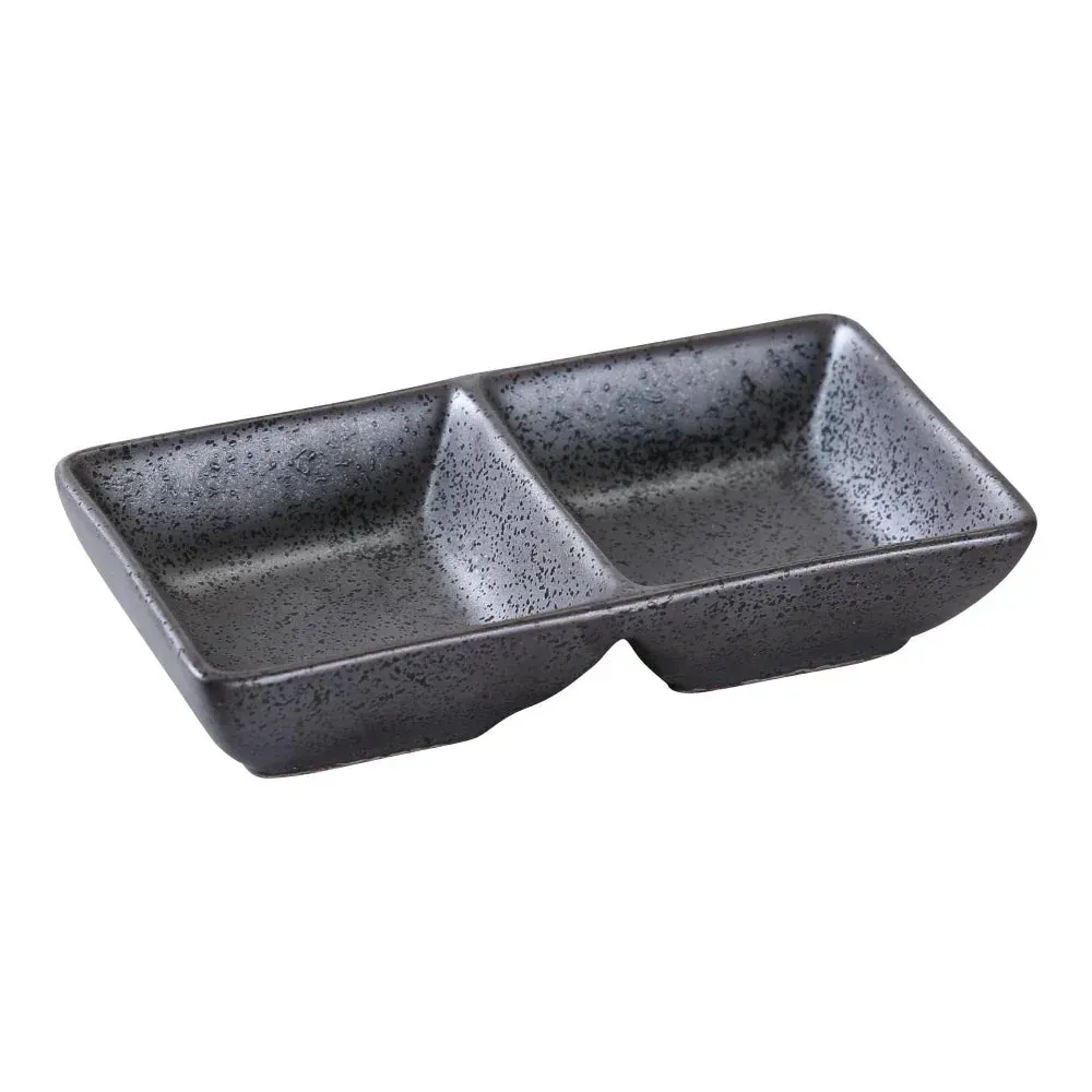 Matte black two-compartment sauce dish by Yanco China, sleek lines, perfect for dipping sauces, durable porcelain for modern bistros or sushi bars.