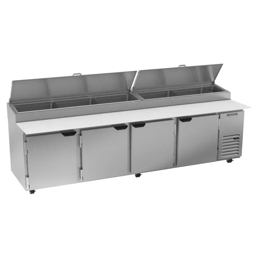 Beverage-Air four-door pizza prep table with extra-wide refrigerated base, ideal for high-volume pizza kitchens needing large prep space.