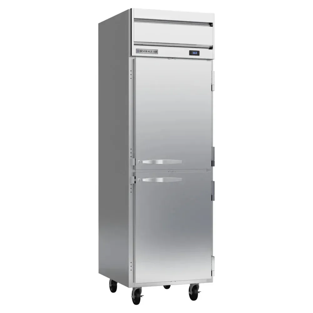 Beverage-Air half solid-door reach-in refrigerator with painted finish conserving energy while chef retrieves fresh herbs in busy prep periods.