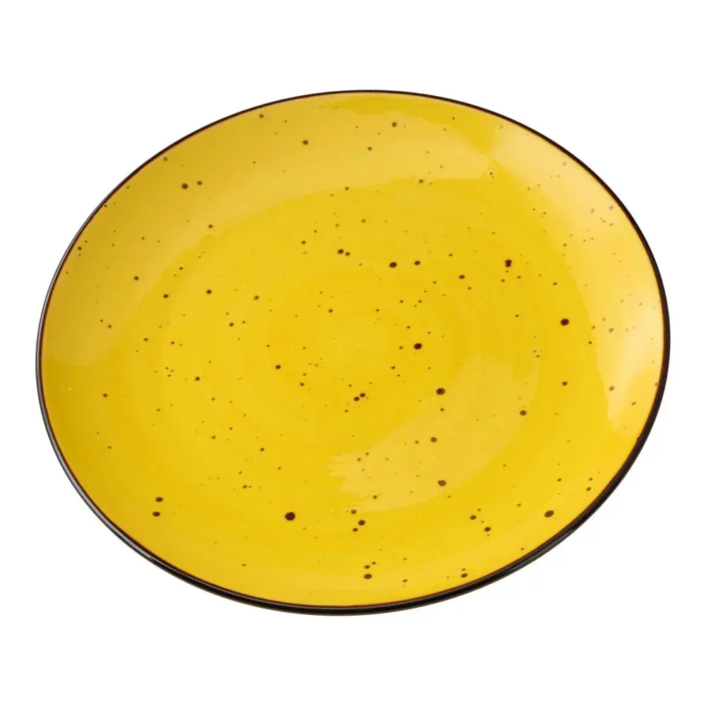 Small round coupe plate from Yanco China with a rustic speckled yellow glaze, ideal for salads or desserts with vibrant handcrafted flair.