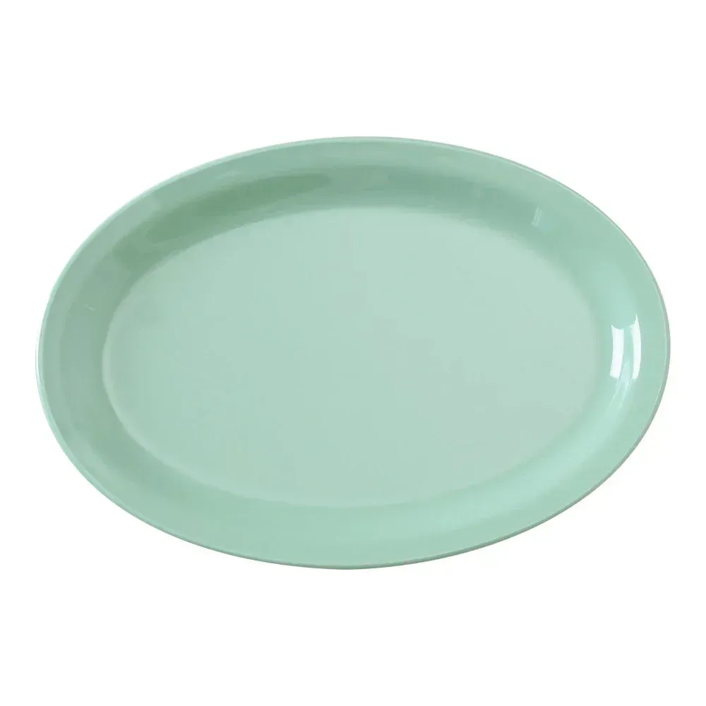 Yanco China green melamine oval platter with narrow rim, ideal for upscale presentation in restaurants, catering, or banquet service.
