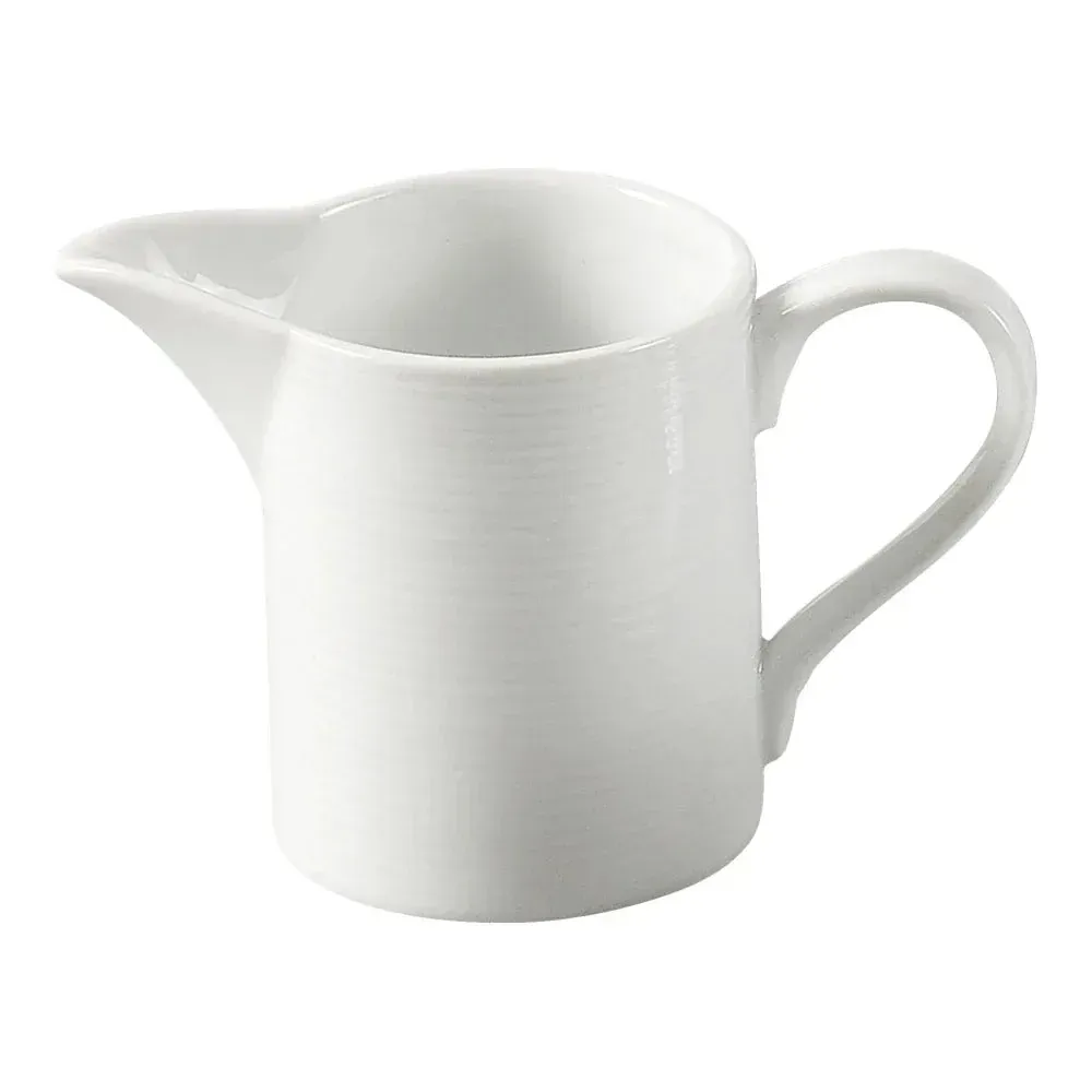 white Yanco China porcelain creamer features petite handle and precise spout for cream, syrup, or sauces at breakfast, tea, or dessert service.