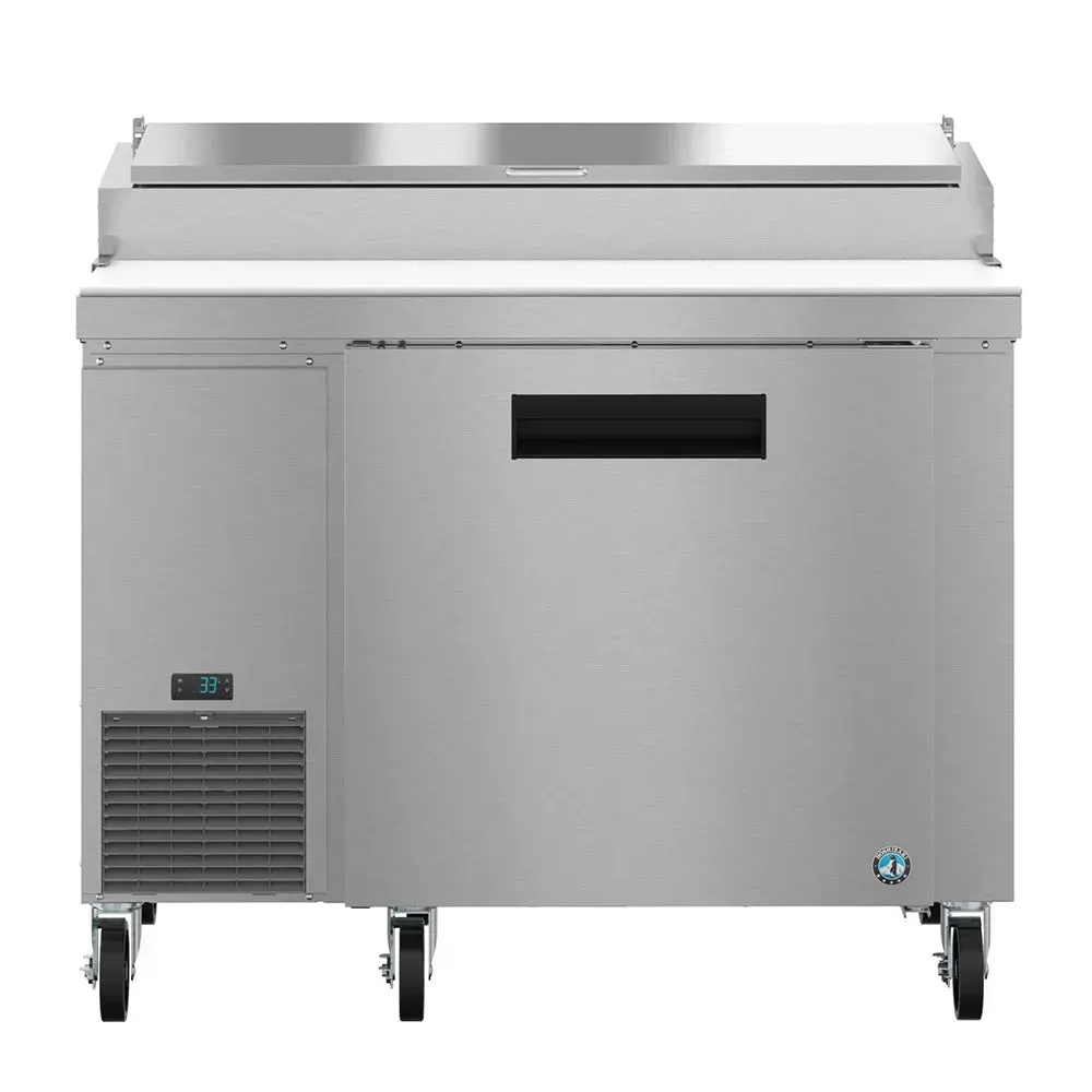 Commercial pizza prep table from Hoshizaki America with a refrigerated base and polished stainless steel finish, in a clean kitchen setting.