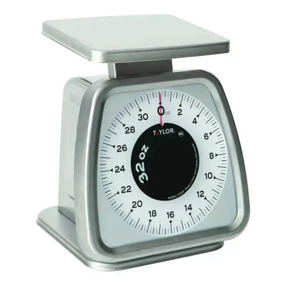 Taylor mechanical portion control scale with fixed dial for clear, reliable readings during repetitive measuring tasks in restaurant kitchens.