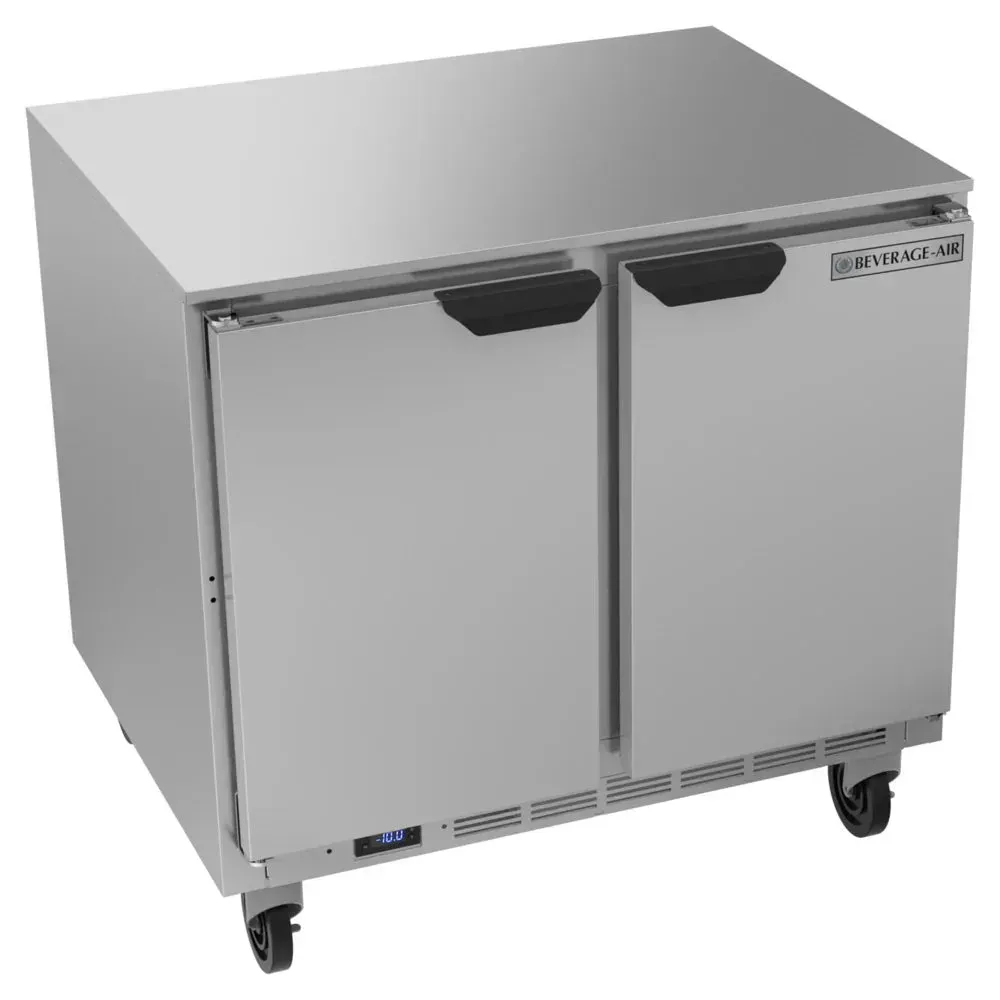 Commercial two-door undercounter freezer by Beverage-Air fits neatly under counters, keeping frozen foods safe in busy restaurant or hotel kitchens.