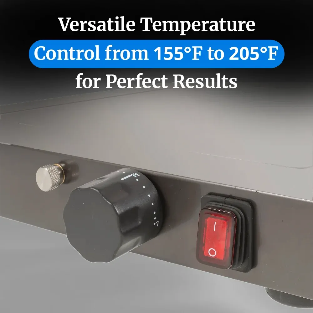 Cadco stainless steel countertop warming shelf with sleek black surface keeps plated meals hot and presentable in restaurants or catering setups.