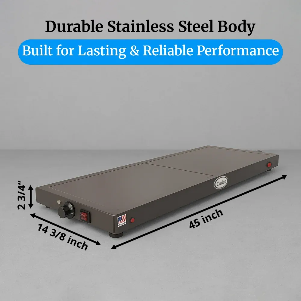 Cadco stainless steel countertop warming shelf with sleek black surface keeps plated meals hot and presentable in restaurants or catering setups.