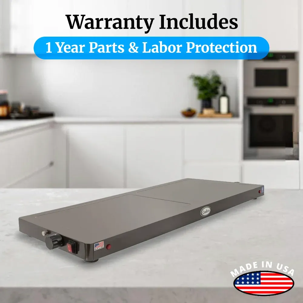 Cadco stainless steel countertop warming shelf with sleek black surface keeps plated meals hot and presentable in restaurants or catering setups.
