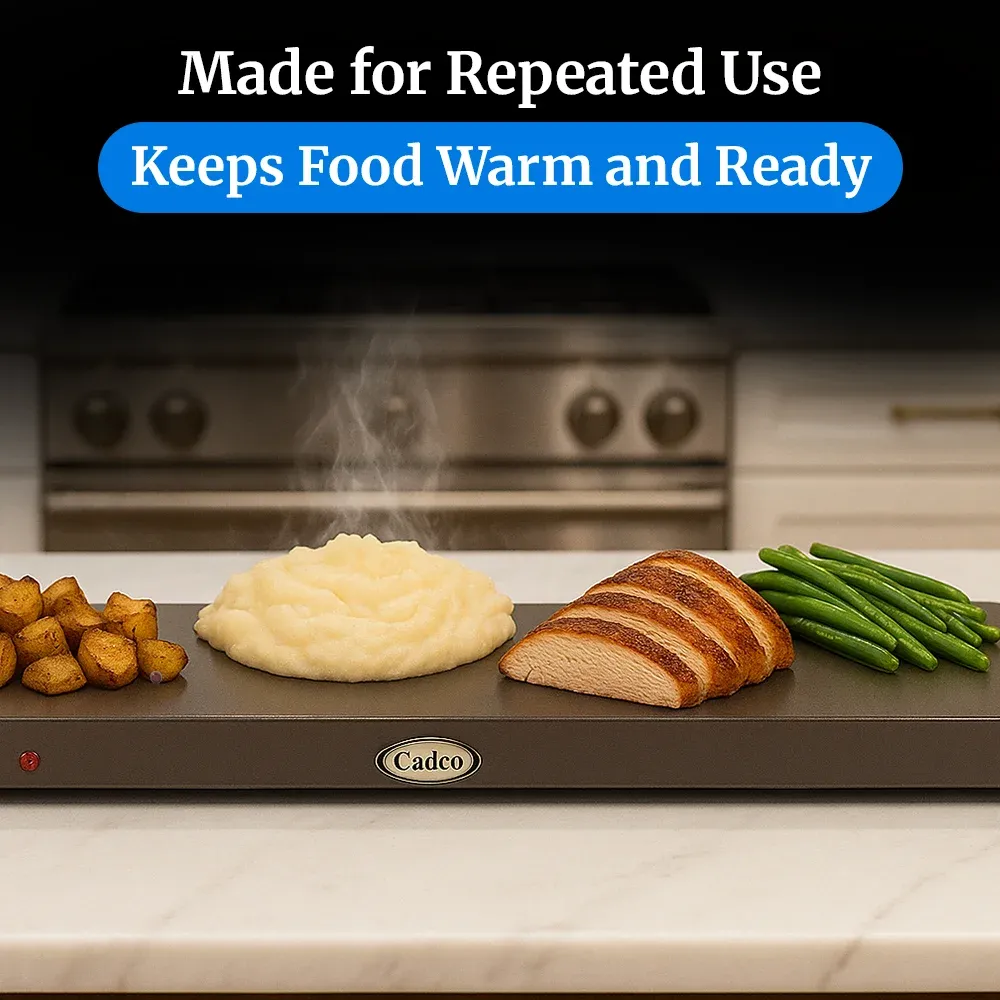 Cadco stainless steel countertop warming shelf with sleek black surface keeps plated meals hot and presentable in restaurants or catering setups.