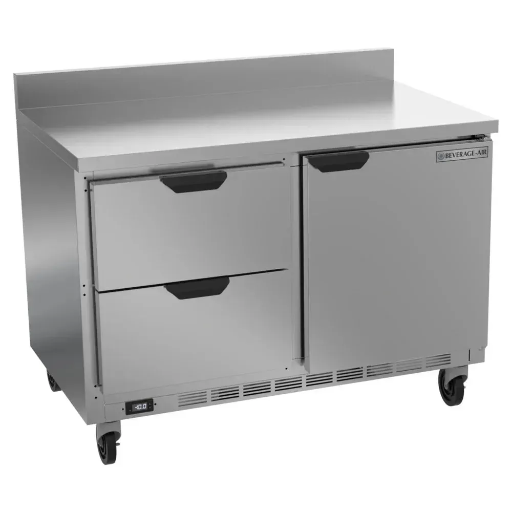 Two-drawer, one-door worktop freezer with backsplash shields walls and stores frozen items; Beverage-Air stainless unit fits busy cafe kitchen setups.