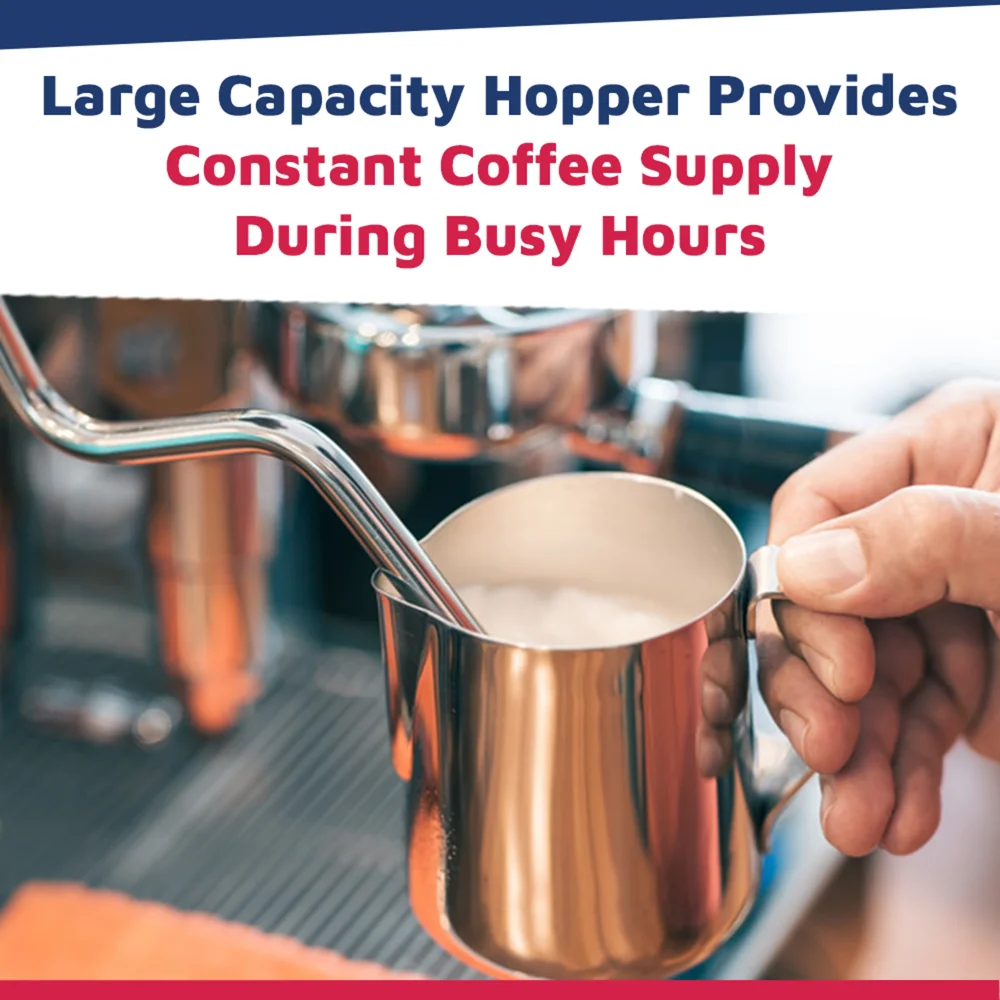 Nuova Simonelli Mythos Basic espresso grinder in matte black with large transparent hopper rests on a barista counter under soft, warm lighting.