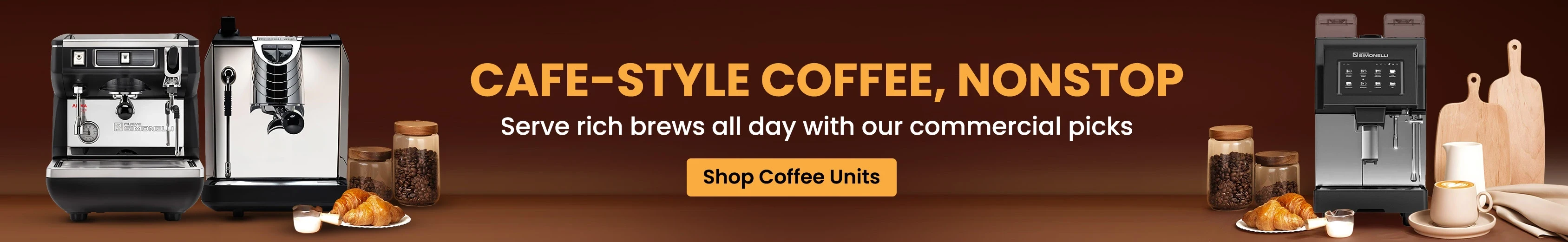 Professional commercial coffee machines with cups, croissants, and jars of coffee beans, designed for serving rich cafe-style brews all day.